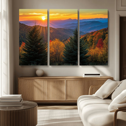 Vibrant sunset over autumn mountains with colorful trees and warm light, ideal for nature lovers or cabin-style wall decor.