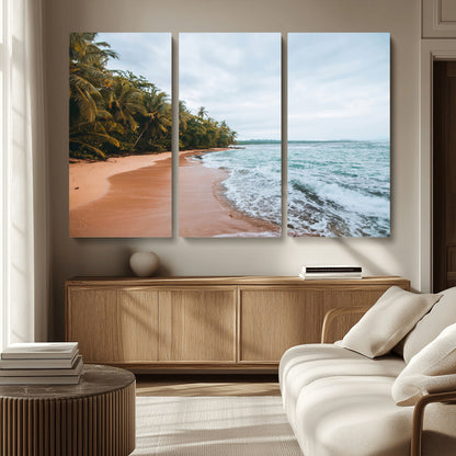 Framed canvas of a tropical beach with palm trees and soft waves, ideal for coastal escape or serene nature-inspired home decor.