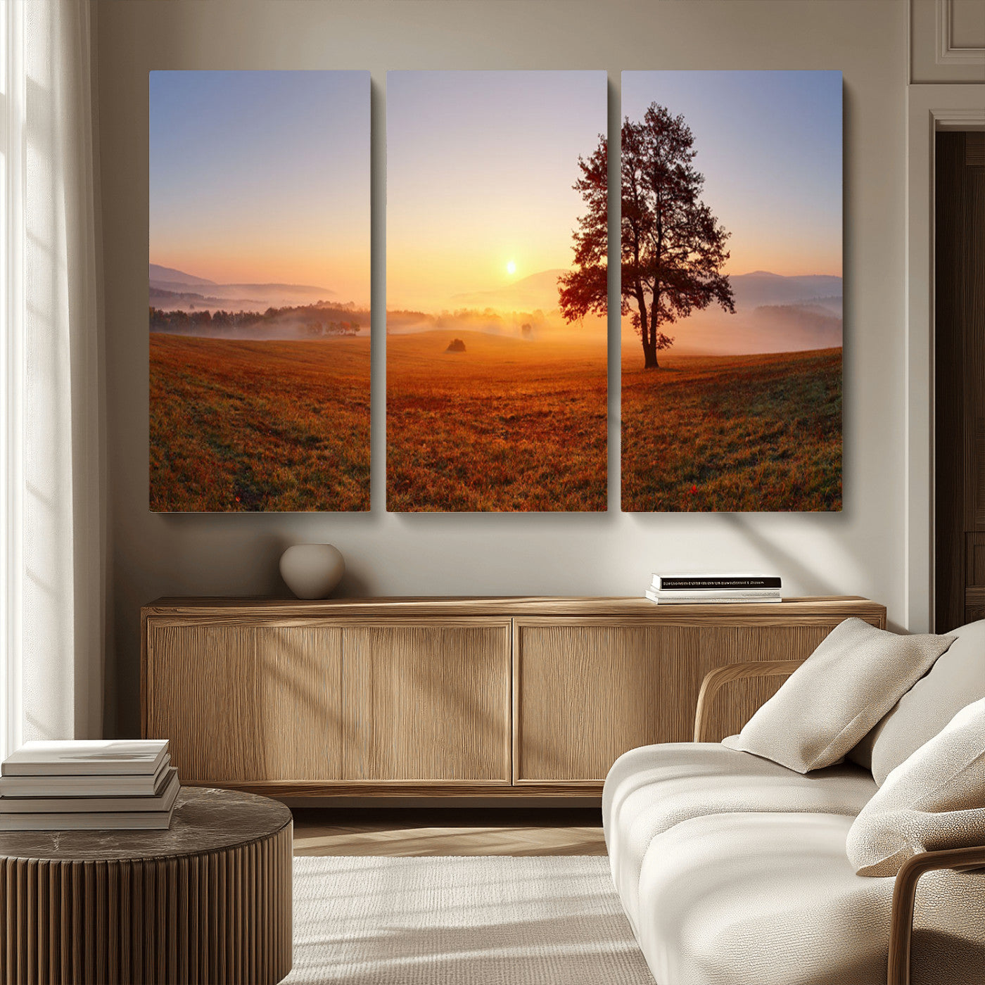 A tranquil landscape at sunrise with a mist-covered field and a lone tree, creating a peaceful and natural atmosphere.