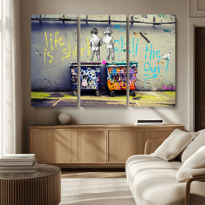Graffiti-style canvas art with bold text and two naked figures over urban dumpsters, ideal for edgy or street-style decor.