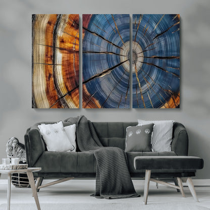 A stunning close-up view of a tree trunk, showcasing the intricate growth rings in a vibrant mix of warm browns, cool blues, and hints of natural texture.