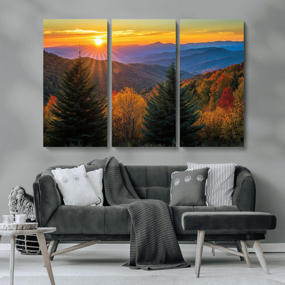 Vibrant sunset over autumn mountains with colorful trees and warm light, ideal for nature lovers or cabin-style wall decor.