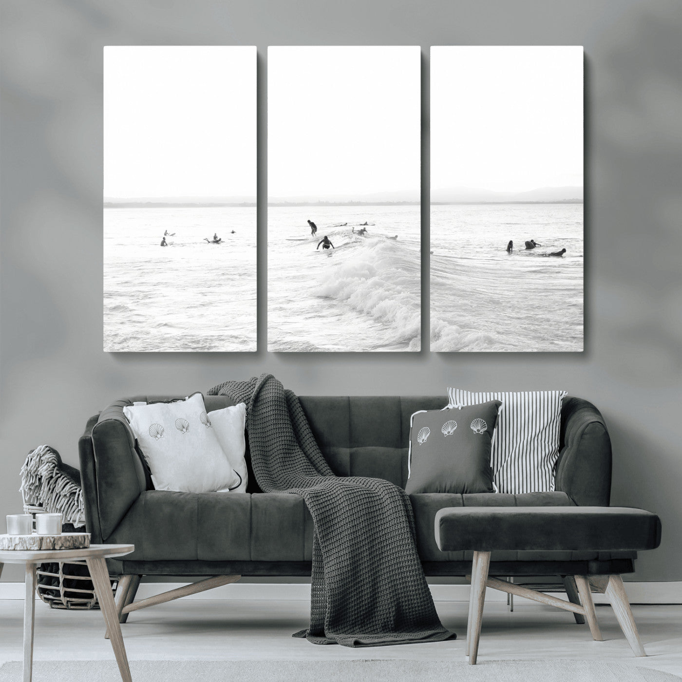 Monochrome photo of surfers riding and waiting on ocean waves, ideal for surf-themed or coastal energy wall decor.
