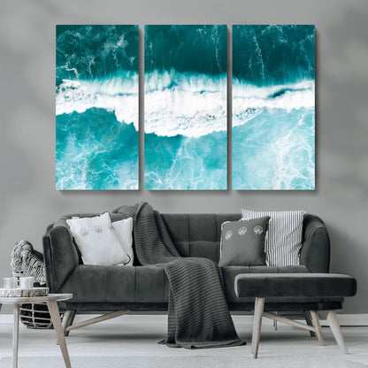 Aerial view of turquoise ocean waves crashing with white foam, perfect for tropical coastal or modern beach-style home decor.