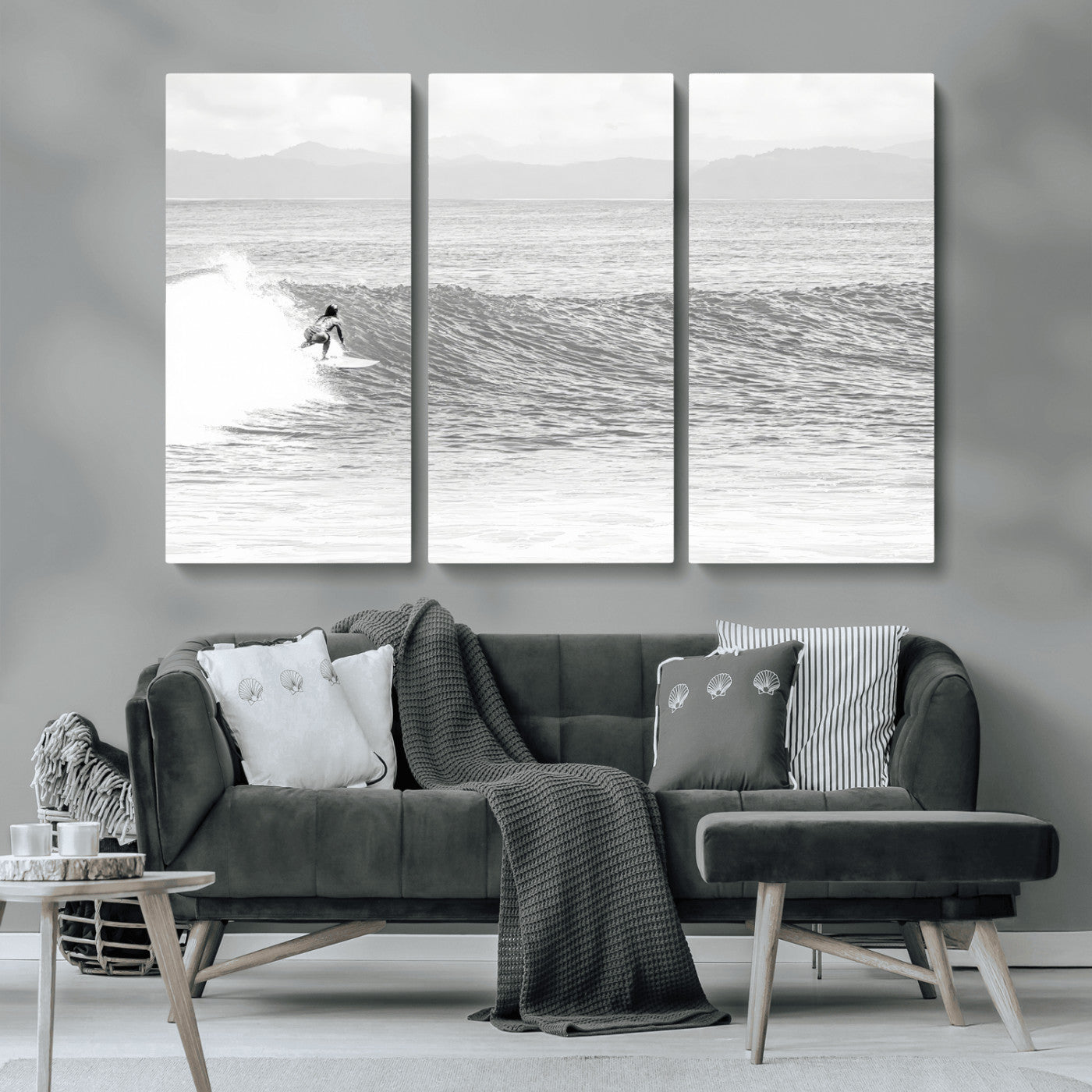 Monochrome photo of a surfer riding a wave with distant mountains, ideal for coastal motion or black and white surf-themed wall decor.