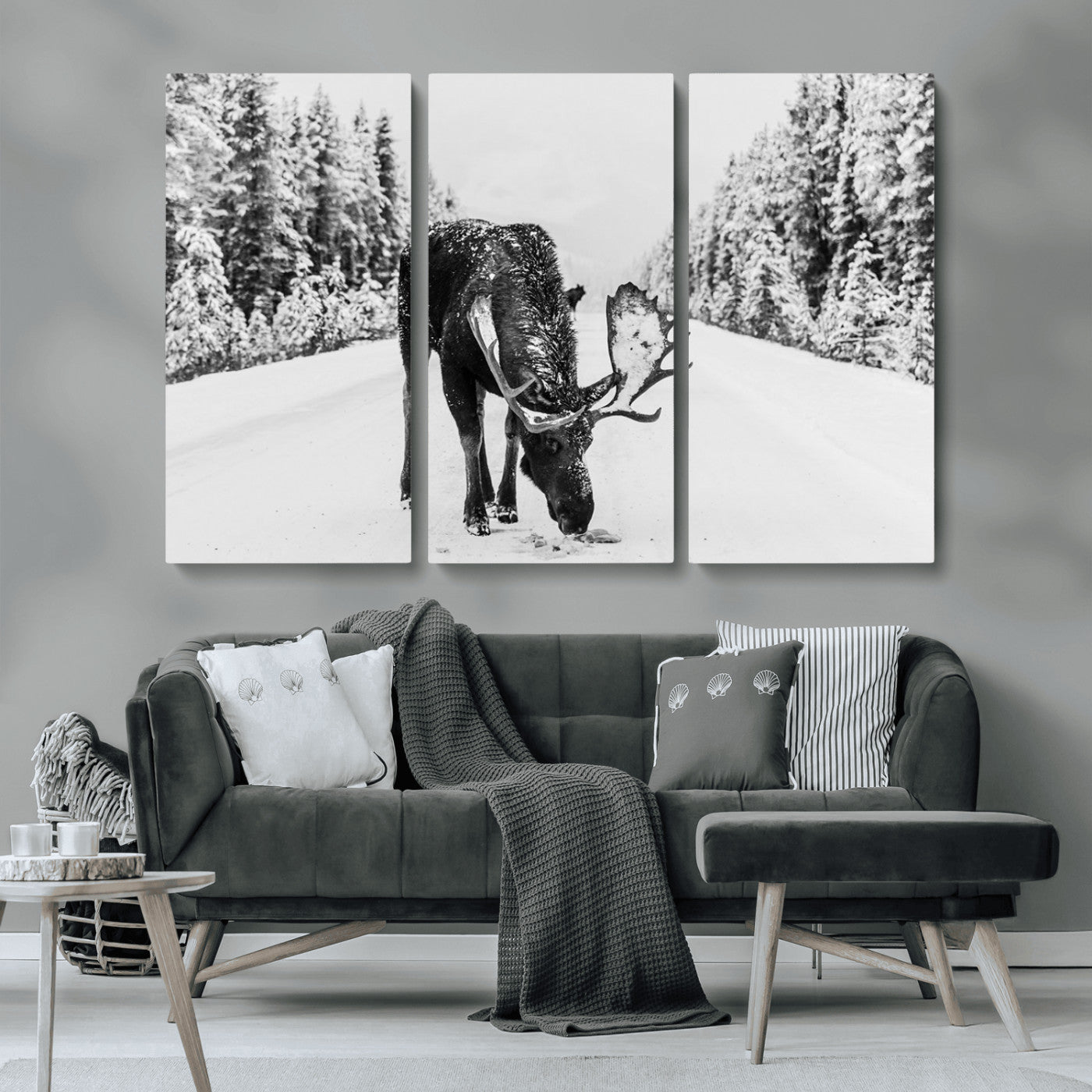 A majestic moose grazing in the snow-covered wilderness, surrounded by snow-covered trees, creating a peaceful winter scene.