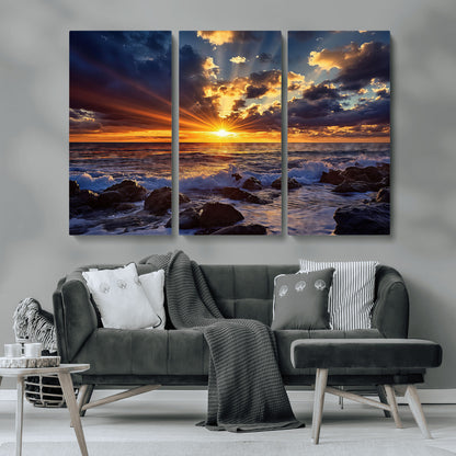 An explosive sunset over the ocean with dramatic clouds and rays of sunlight reflecting off the water, creating a vibrant and captivating view.