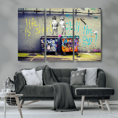 Graffiti-style canvas art with bold text and two naked figures over urban dumpsters, ideal for edgy or street-style decor.