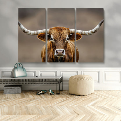 Close-up of a Texas Longhorn with strong curved horns and warm brown tones, perfect for rustic or western-style wall decor.