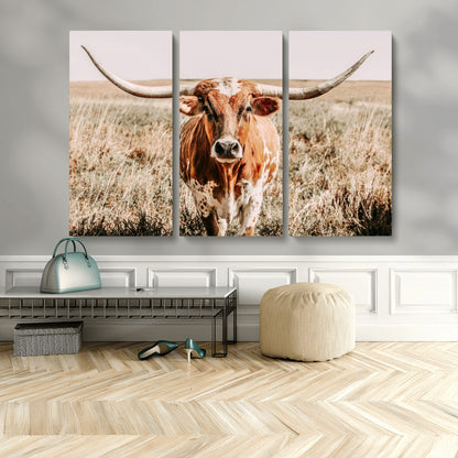 Framed longhorn cow canvas wall art with rustic prairie background, western animal print perfect for farmhouse or ranch style decor
