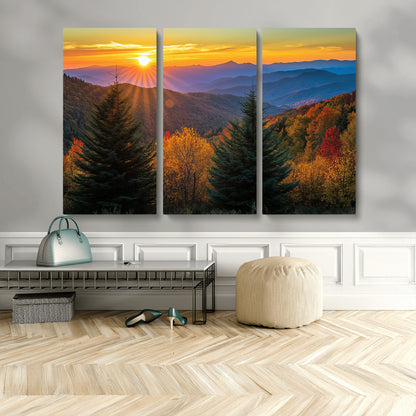 Vibrant sunset over autumn mountains with colorful trees and warm light, ideal for nature lovers or cabin-style wall decor.