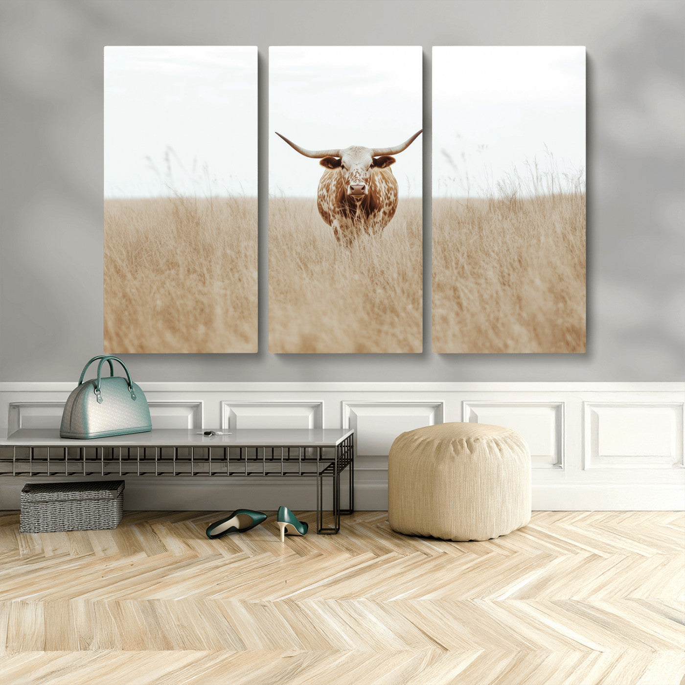 Texas Longhorn bull standing alone in dry grass with neutral tones, ideal for rustic western or cowboy-themed wall decor.