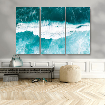 Aerial view of turquoise ocean waves crashing with white foam, perfect for tropical coastal or modern beach-style home decor.
