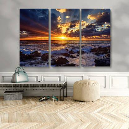 An explosive sunset over the ocean with dramatic clouds and rays of sunlight reflecting off the water, creating a vibrant and captivating view.