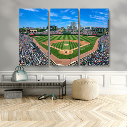 A wide-angle shot of a baseball field filled with spectators, with players on the field and the iconic Wrigley Field scoreboard in the background.