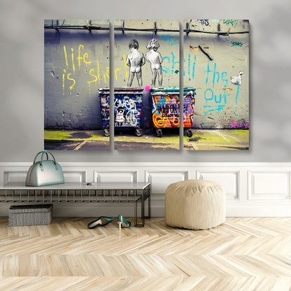 Graffiti-style canvas art with bold text and two naked figures over urban dumpsters, ideal for edgy or street-style decor.