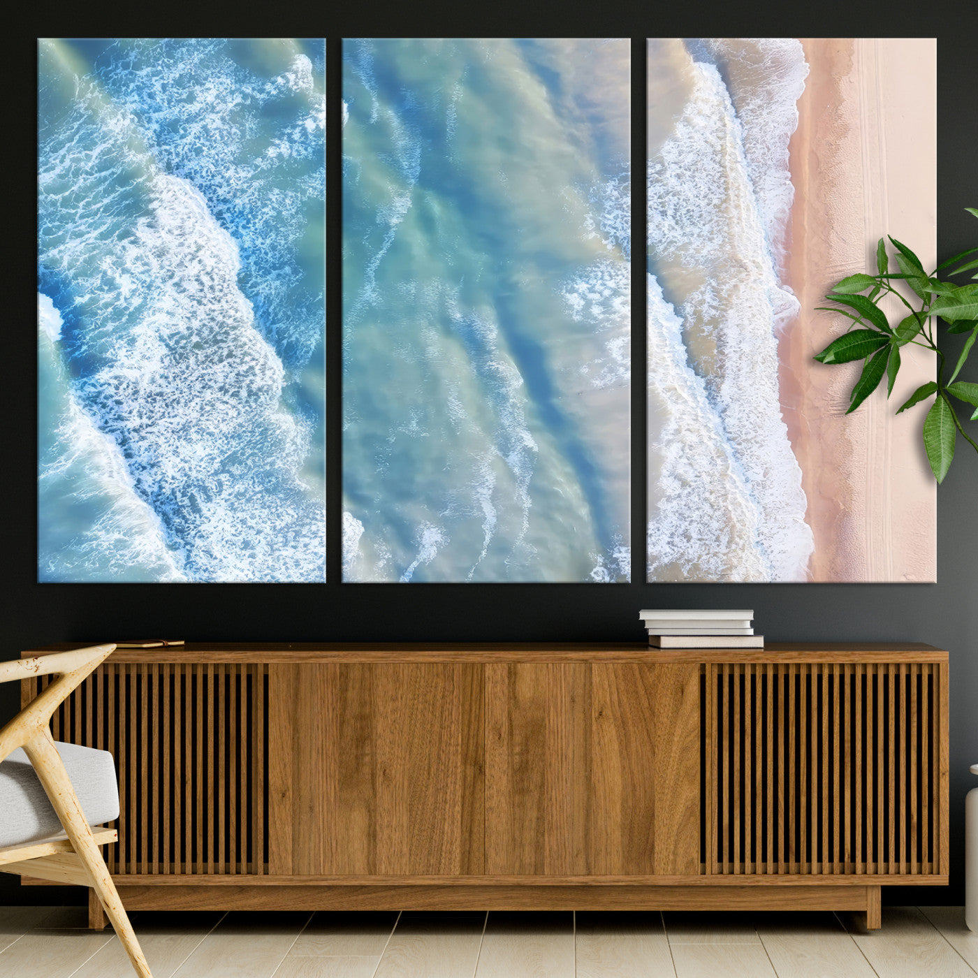 Aerial photo of soft blue waves meeting sandy shore, perfect for modern coastal or beach-themed decor with a light and tranquil aesthetic.