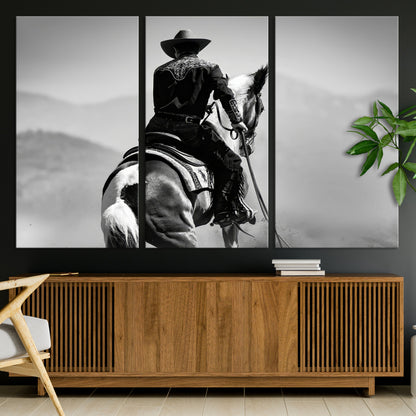 Black and white canvas of a cowboy on horseback with moody tones, perfect for rustic western or country-inspired home decor.