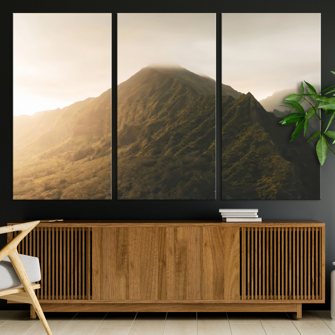 Sunlit mountain peak with mist rolling over its rugged slopes, bathed in golden light, creating a warm and tranquil nature-inspired scene.