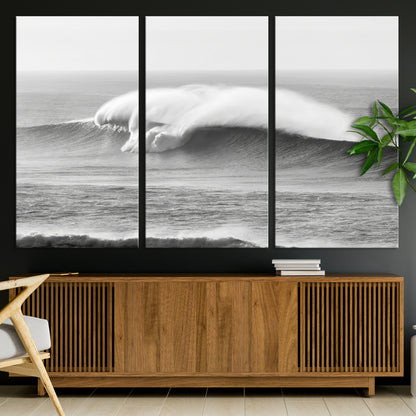 A dramatic black and white ocean wave crashing with immense force, capturing the raw power and movement of the sea in a bold seascape.