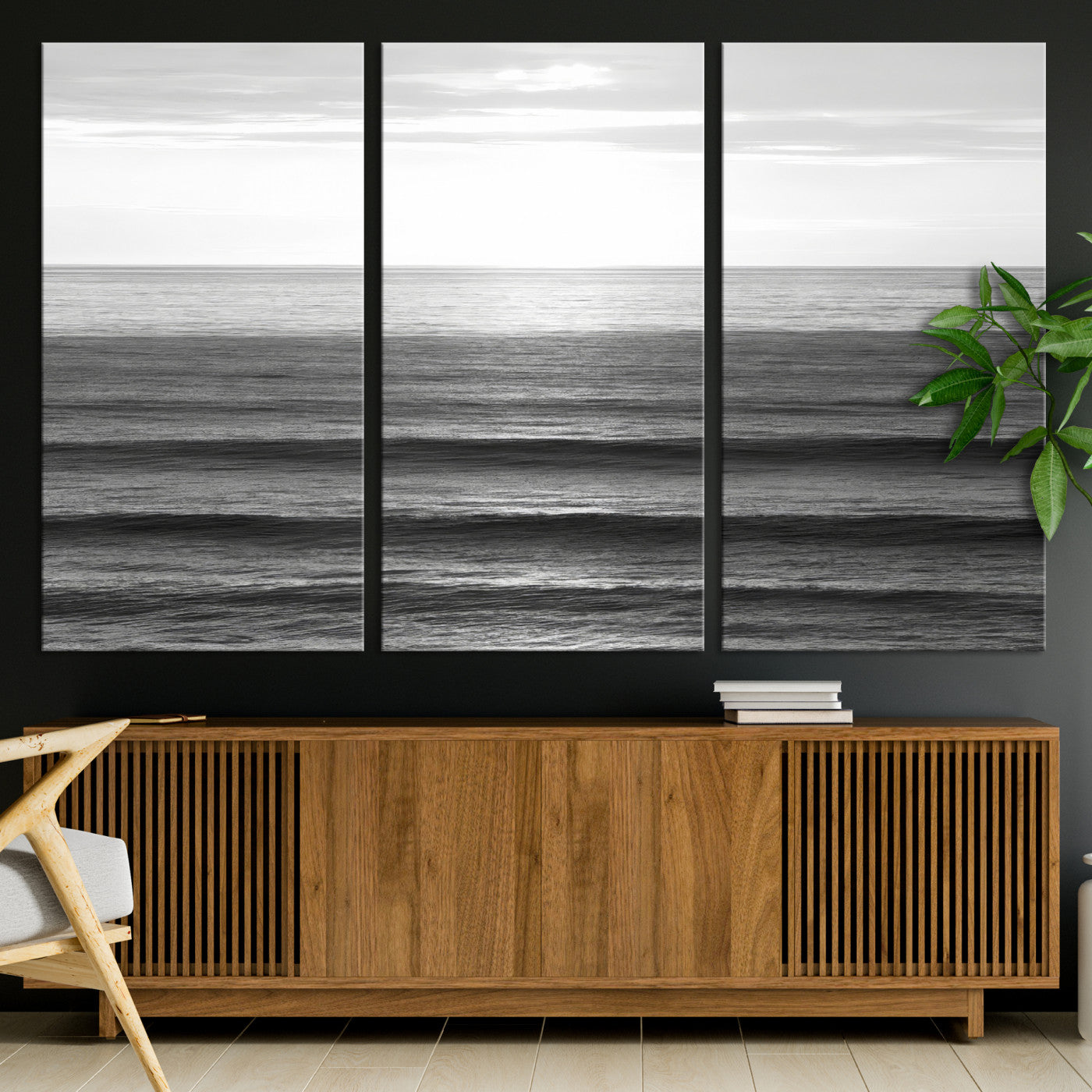 Minimalist black and white ocean view with layered waves reflecting sunlight, evoking a sense of calm and coastal serenity.