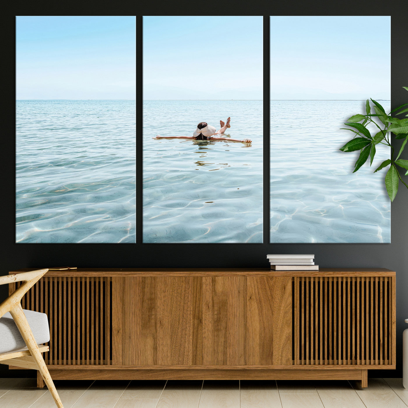A peaceful minimalist scene of a person floating on crystal-clear water, surrounded by a vast open horizon, capturing relaxation and serenity in a tranquil aquatic setting.