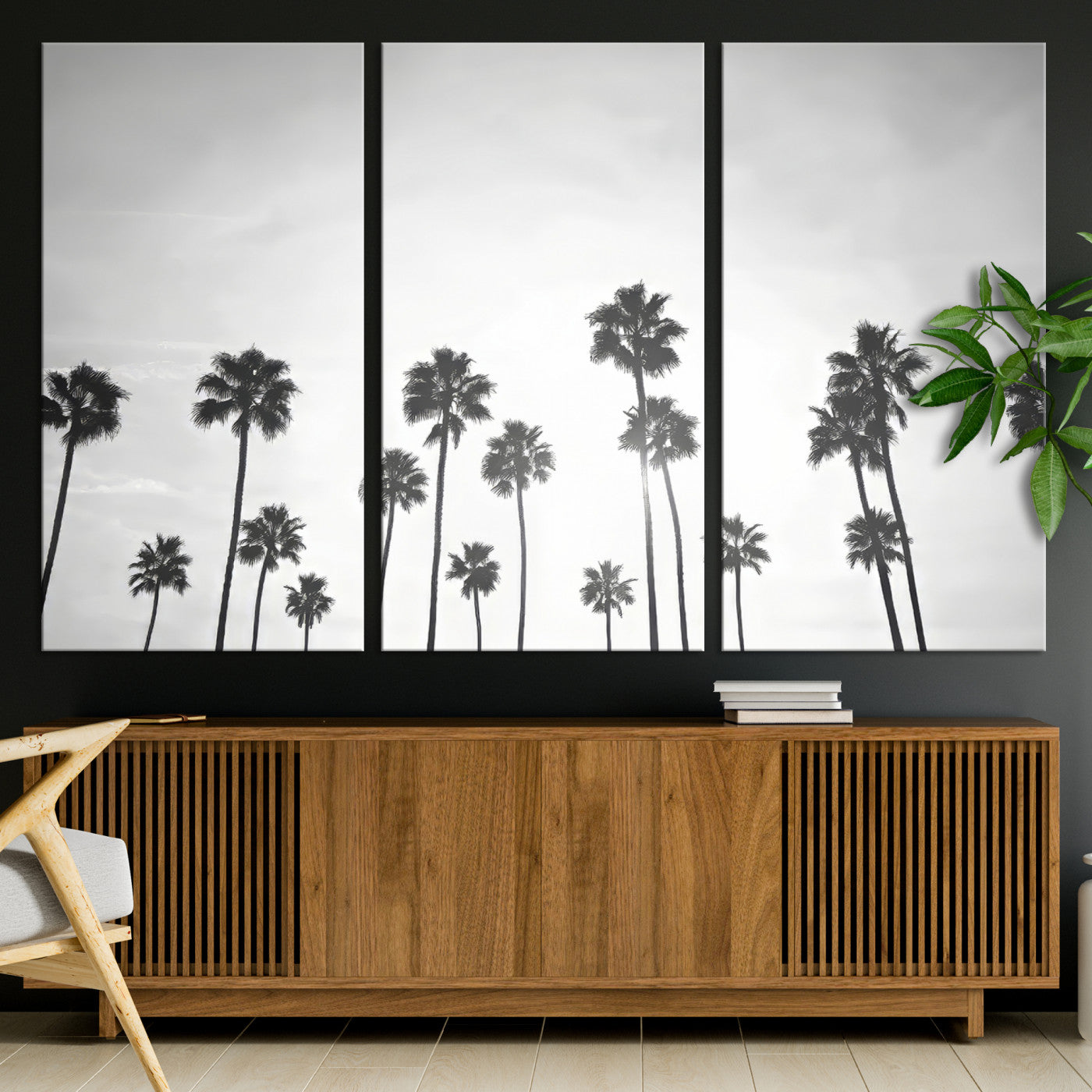 A black and white minimalist scene featuring tall palm trees silhouetted against a bright sky, creating a dreamy and timeless tropical aesthetic.