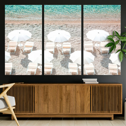 A bright beach scene with white umbrellas, pastel sand, and turquoise waters, creating a tranquil coastal vibe, perfect for beach house or summer decor.