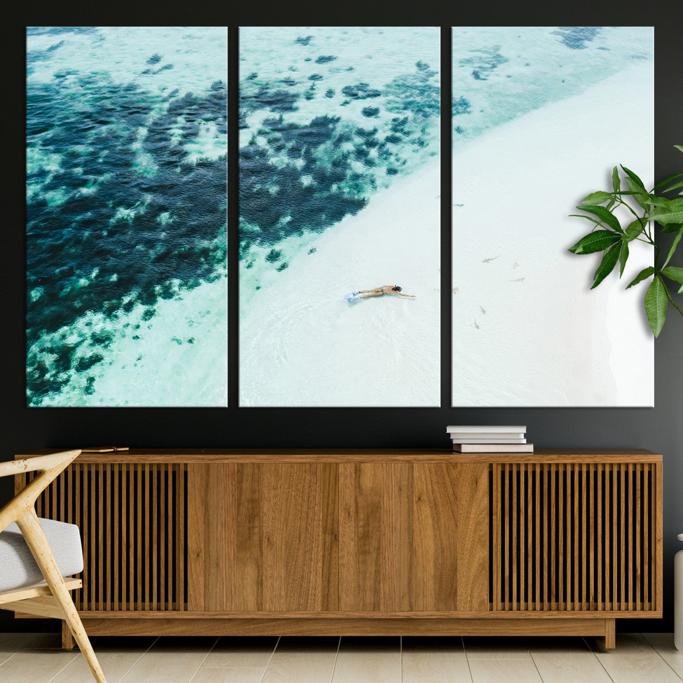 Canvas featuring an aerial view of a swimmer in shallow turquoise waters with coral patterns, ideal for tropical coastal home decor.