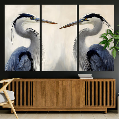 Two blue herons facing each other on a soft neutral background, ideal for coastal, tranquil, or nature-inspired minimalist interiors.