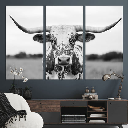 Capture the strength and elegance of nature with this striking black and white portrait of a longhorn cow. Its powerful presence makes a bold statement in any room.