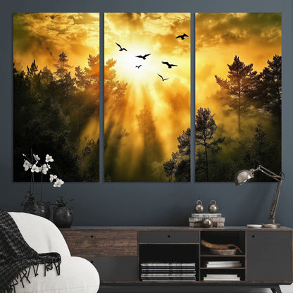 Canvas of a golden forest at sunset with birds flying through glowing sunbeams and silhouetted pine trees, ideal for warm-toned rustic decor.