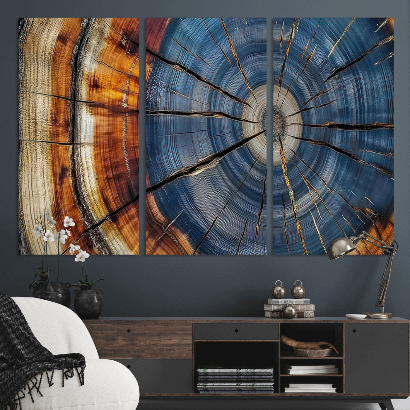A stunning close-up view of a tree trunk, showcasing the intricate growth rings in a vibrant mix of warm browns, cool blues, and hints of natural texture.