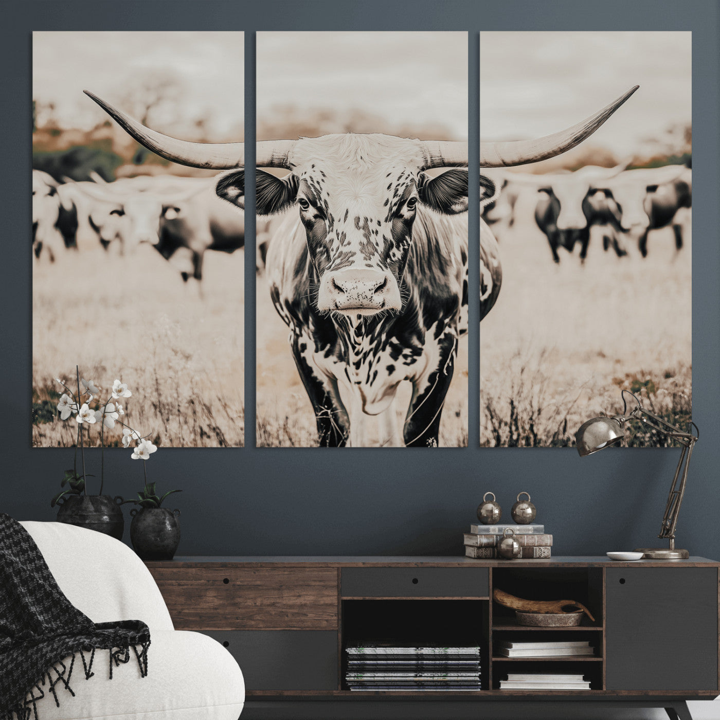 Canvas of a speckled Texas longhorn standing boldly in a field with a herd behind, perfect for rustic western or farmhouse wall decor.