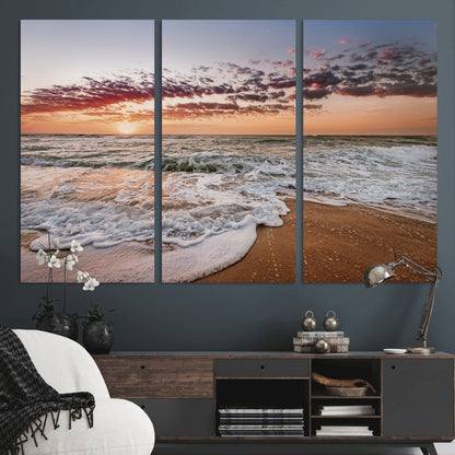 Canvas of a sunset over a foamy ocean shore with warm light and gentle waves, ideal for coastal or beach-themed home decor.
