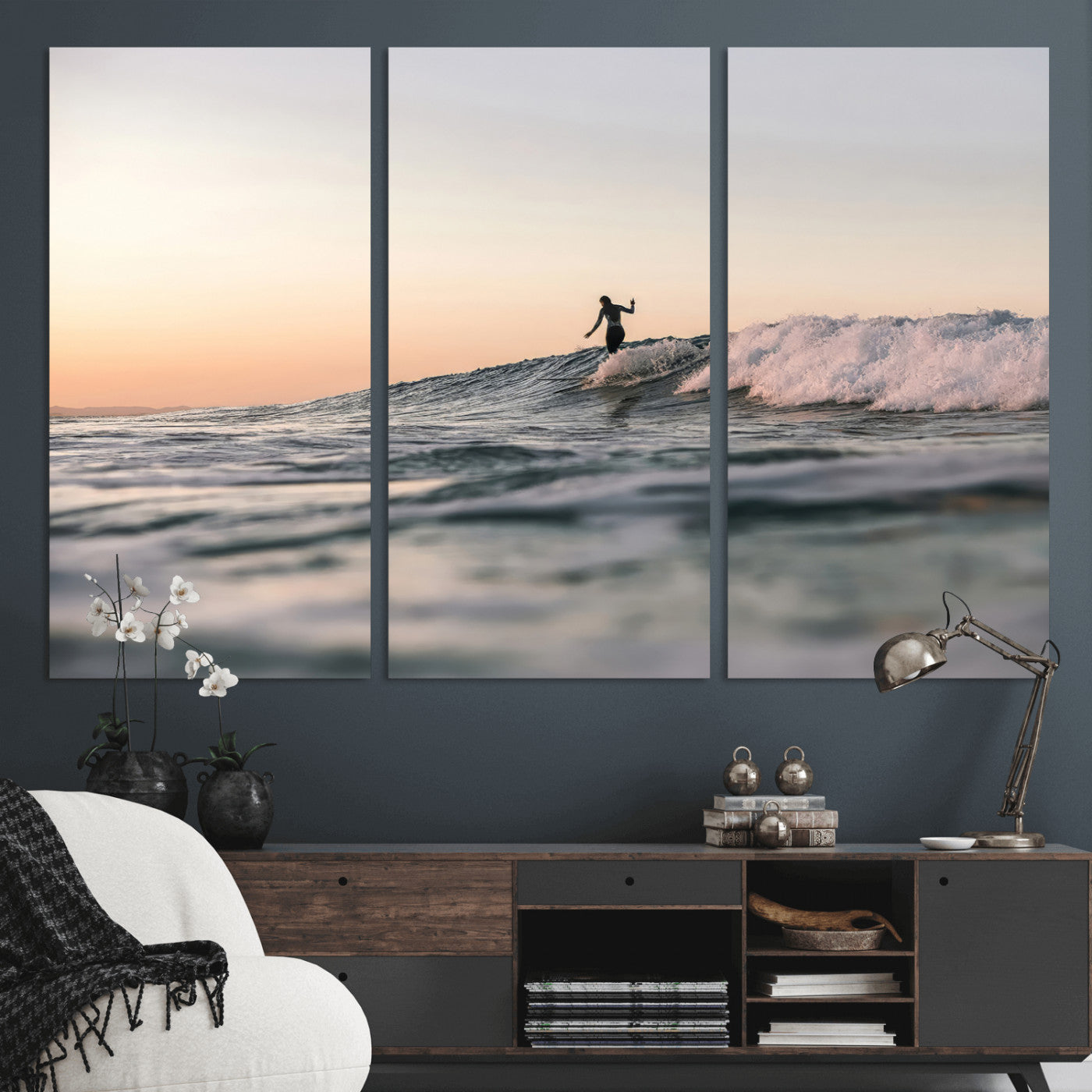 Framed canvas of a female surfer balancing on a wave at sunset, perfect for serene surf or ocean-inspired coastal decor.