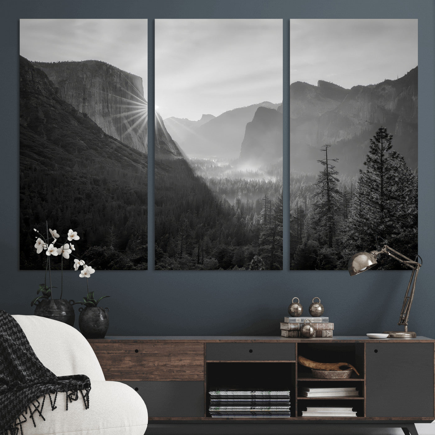 Black and white landscape of Yosemite with sun rays peeking over El Capitan, ideal for moody nature or modern rustic decor.