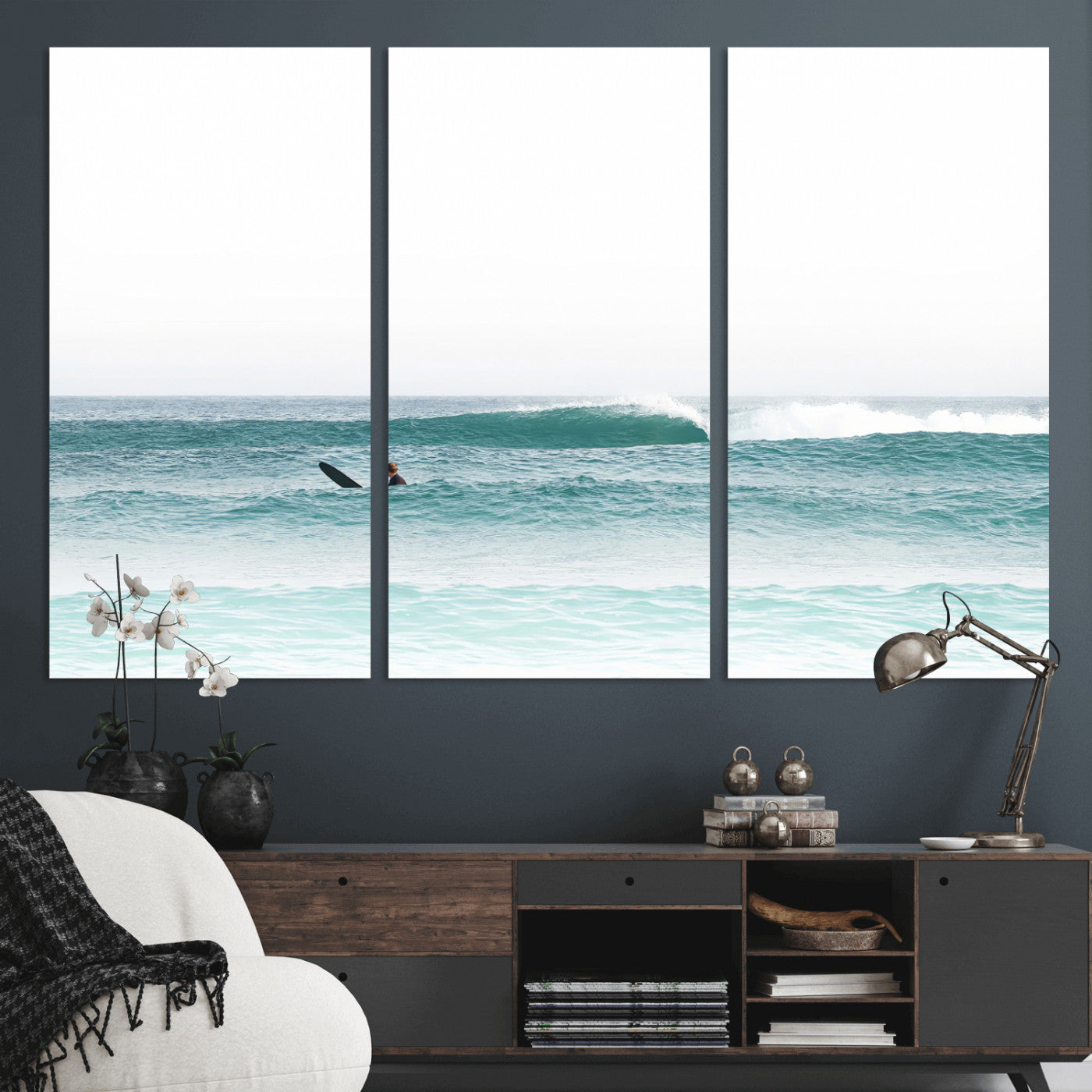 Minimalist photo of a lone surfer on calm aqua waves under bright sky, perfect for Scandinavian coastal or serene ocean-inspired home decor.
