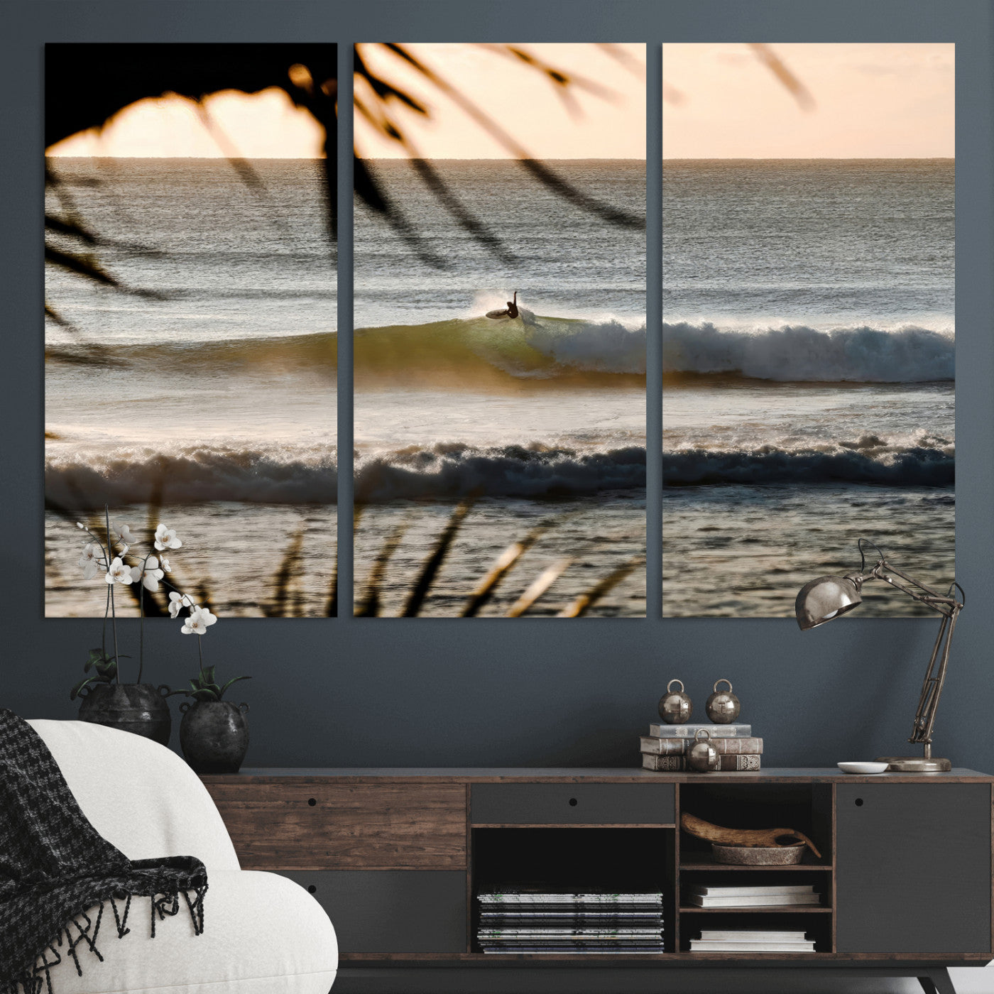 Photo of a surfer riding a golden hour wave at sunset, with tropical tones and dreamy light, perfect for tropical boho or coastal home decor.