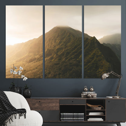 Sunlit mountain peak with mist rolling over its rugged slopes, bathed in golden light, creating a warm and tranquil nature-inspired scene.