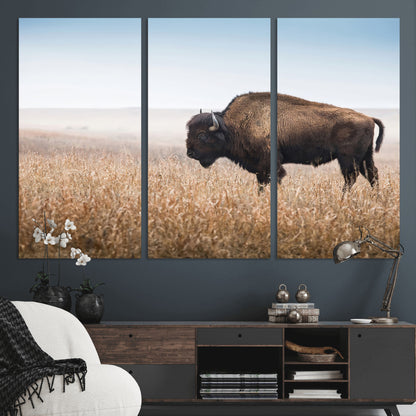 A majestic bison standing in an open prairie field, its strong form blending into the golden grass under a vast blue sky, evoking the wild spirit of the American plains.