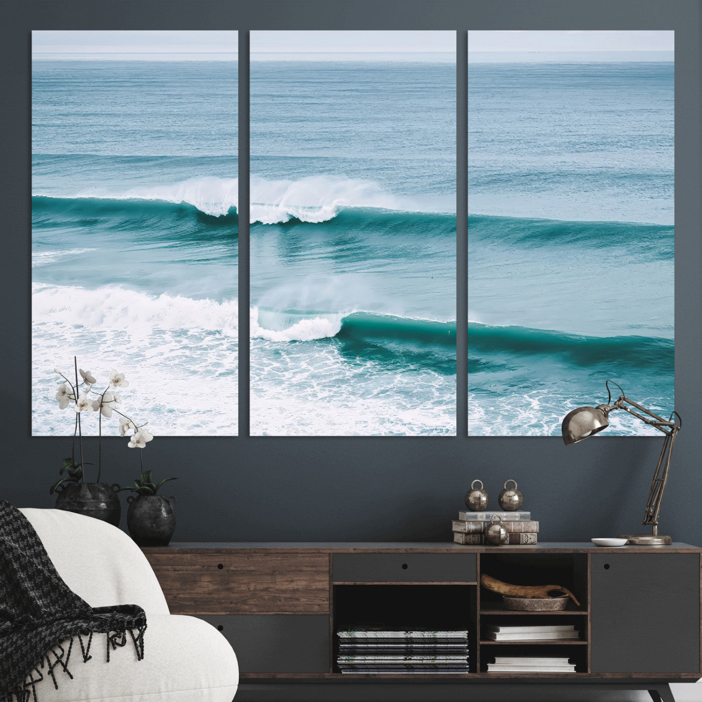 Powerful ocean waves rolling towards the shore, their turquoise hues blending with white sea foam under an open horizon, capturing the essence of the ocean's movement.