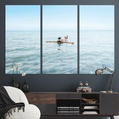 A peaceful minimalist scene of a person floating on crystal-clear water, surrounded by a vast open horizon, capturing relaxation and serenity in a tranquil aquatic setting.