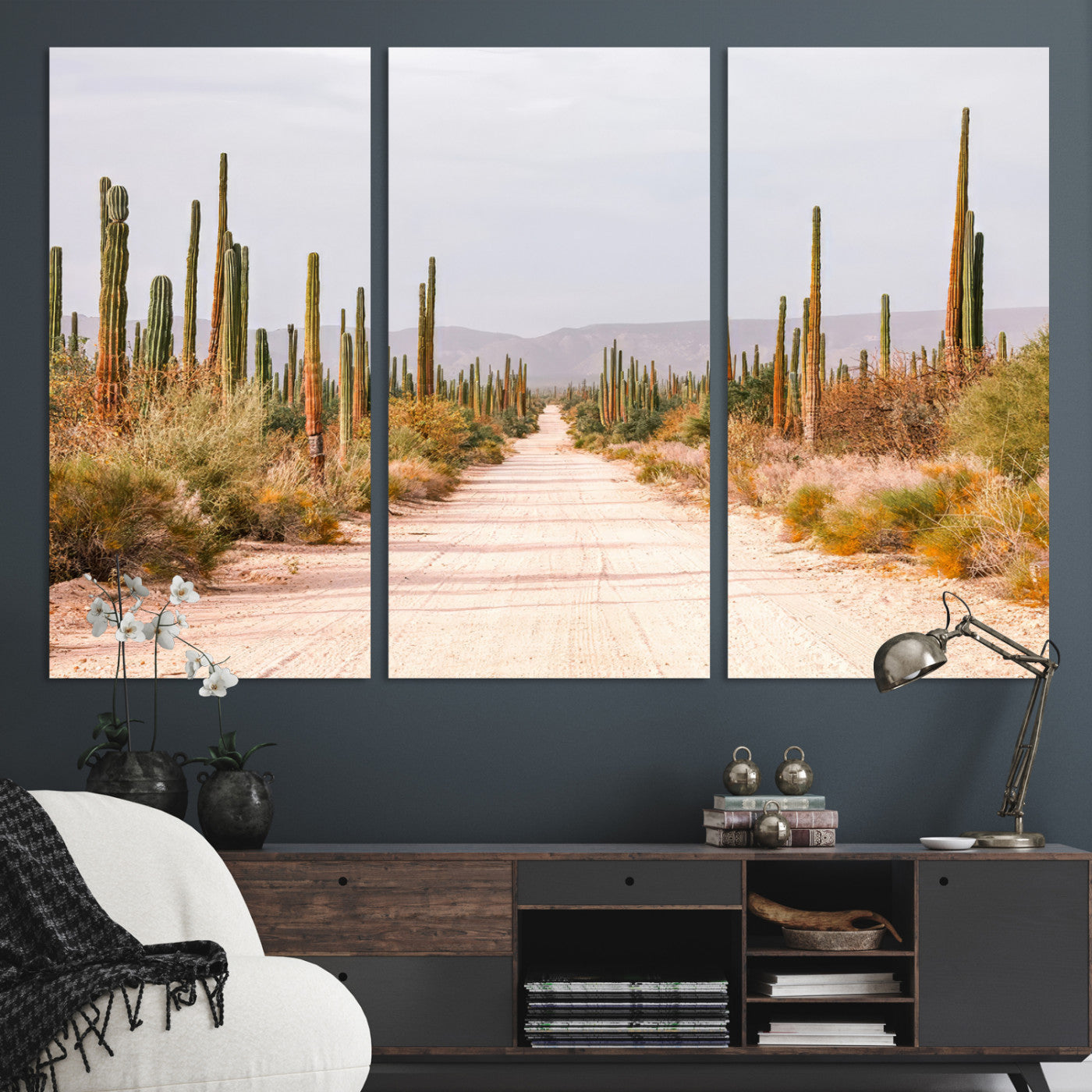 A desert road lined with saguaro cacti under a golden sky, creating a warm southwestern feel, perfect for boho or rustic decor.