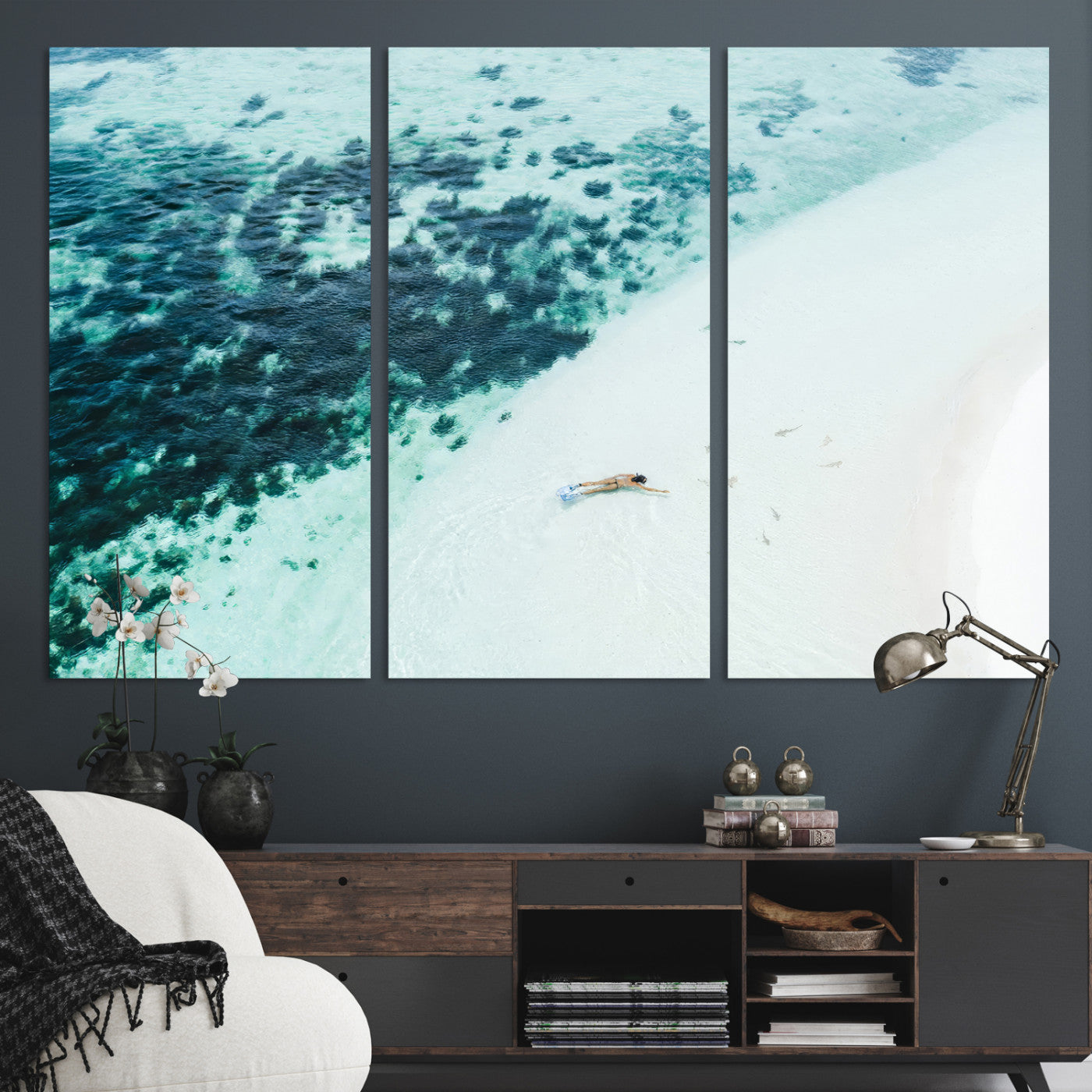 Canvas featuring an aerial view of a swimmer in shallow turquoise waters with coral patterns, ideal for tropical coastal home decor.