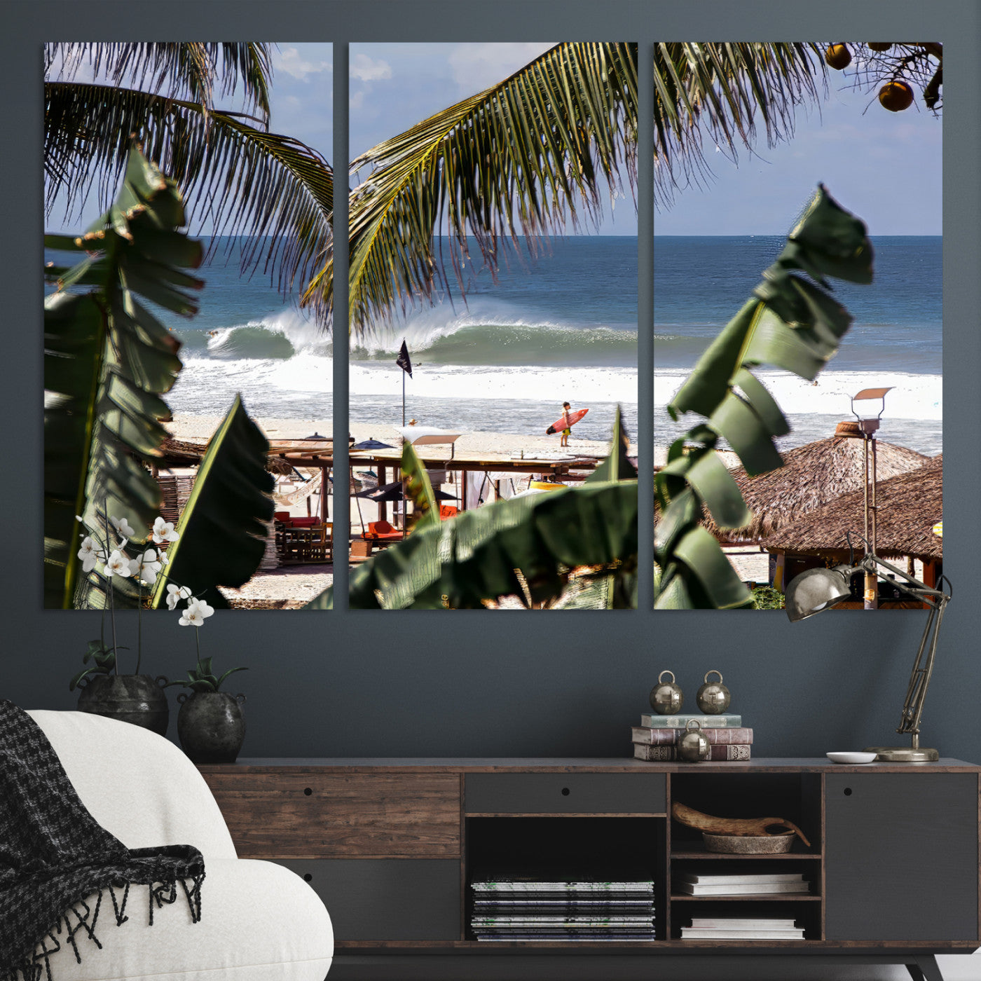 Canvas wall art of a tropical surf scene framed by palm trees, with a surfer on the shore and waves rolling in, ideal for beach-themed decor.