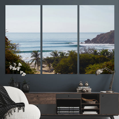 View of calm ocean waves with palm trees and a tropical coastline, ideal for coastal boho or beach-themed wall decor.