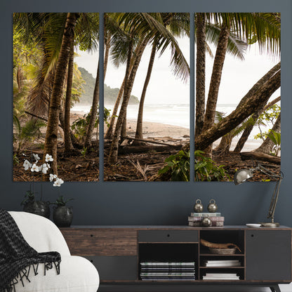 Dense tropical palm trees framing a sandy beach and ocean shore, ideal for jungle or coastal themed interior wall decor.