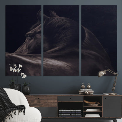 Close-up of a black horse with dramatic lighting on a dark background, perfect for rustic or masculine home decor.