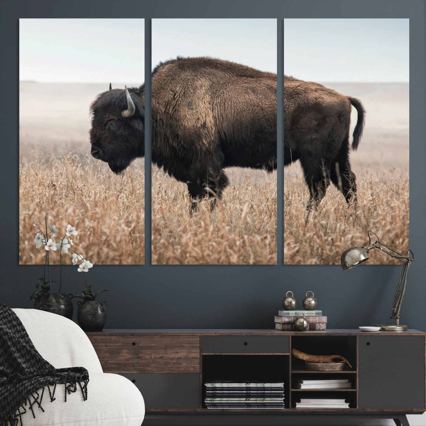 A lone bison stands in a vast prairie under a soft sky, evoking freedom and rustic charm for western or farmhouse inspired interiors.